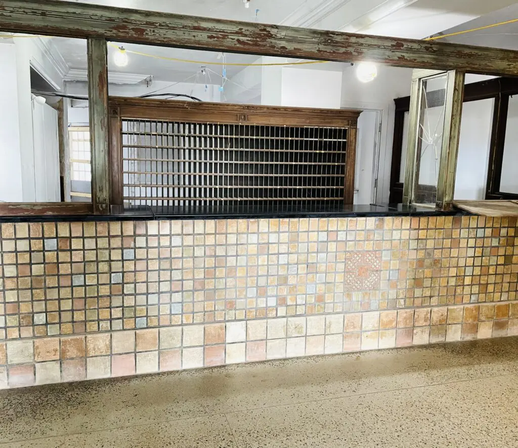 The check-in desk still sports its original tile and wooden key box. (Photo by Courtney Dabney)