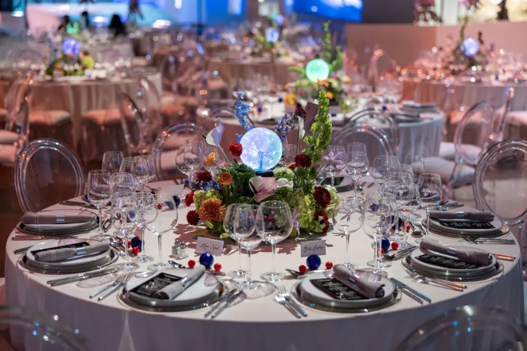 Dinner tables feature plasma orb and floral centerpieces at the preview of HMNS' re-imagined Welch Hall: Matter & Motion (Photo by Mike Rathke, HMNS Photographer)