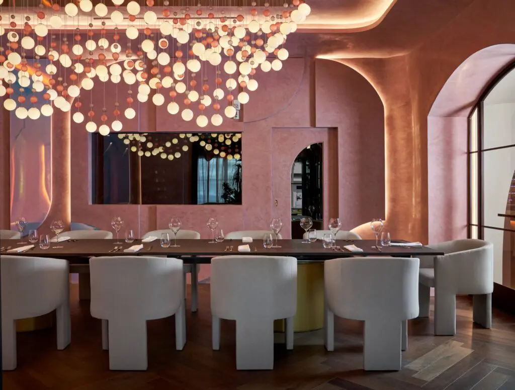 The chef's table dining room in Cocody in River Oaks Shopping Center includes the whimsical chandelier by  Preciosa. (Photo courtesy of Nina Magon Studio))