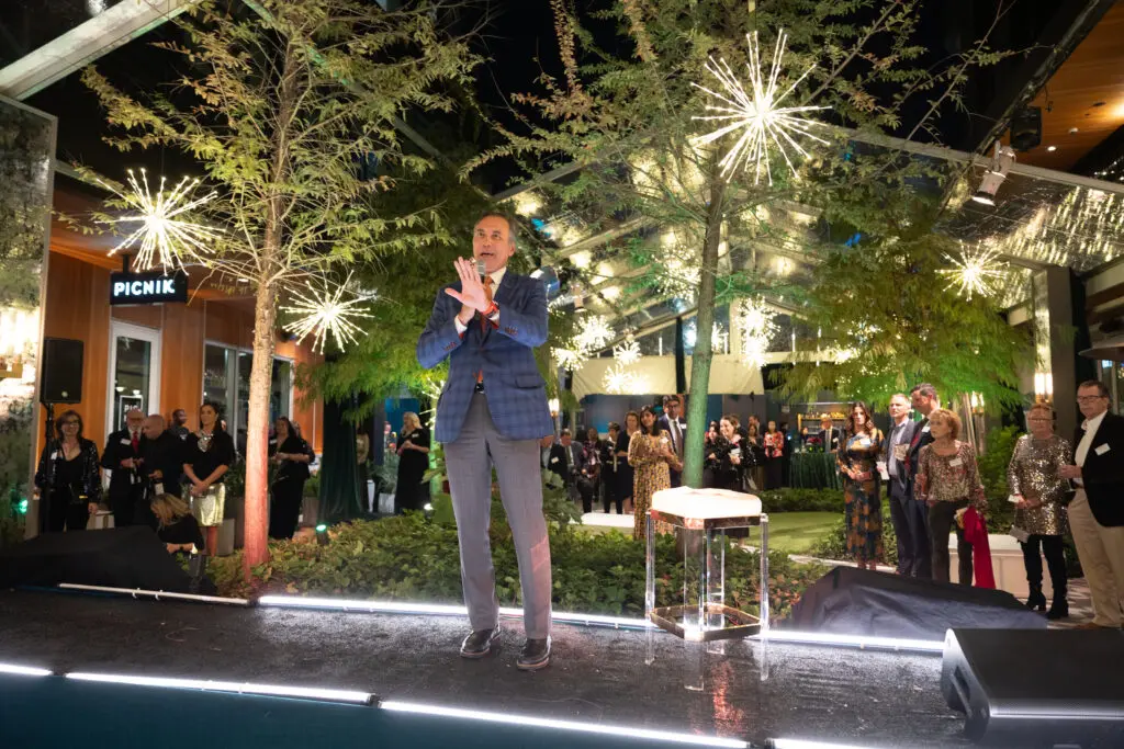 Dr. Jim Versalovic addresses guests at Texas Children's Hospital Ambassadors holiday party held at the Montrose Collective. (Photo by Jenny Antill/Texas Children's Hospital)