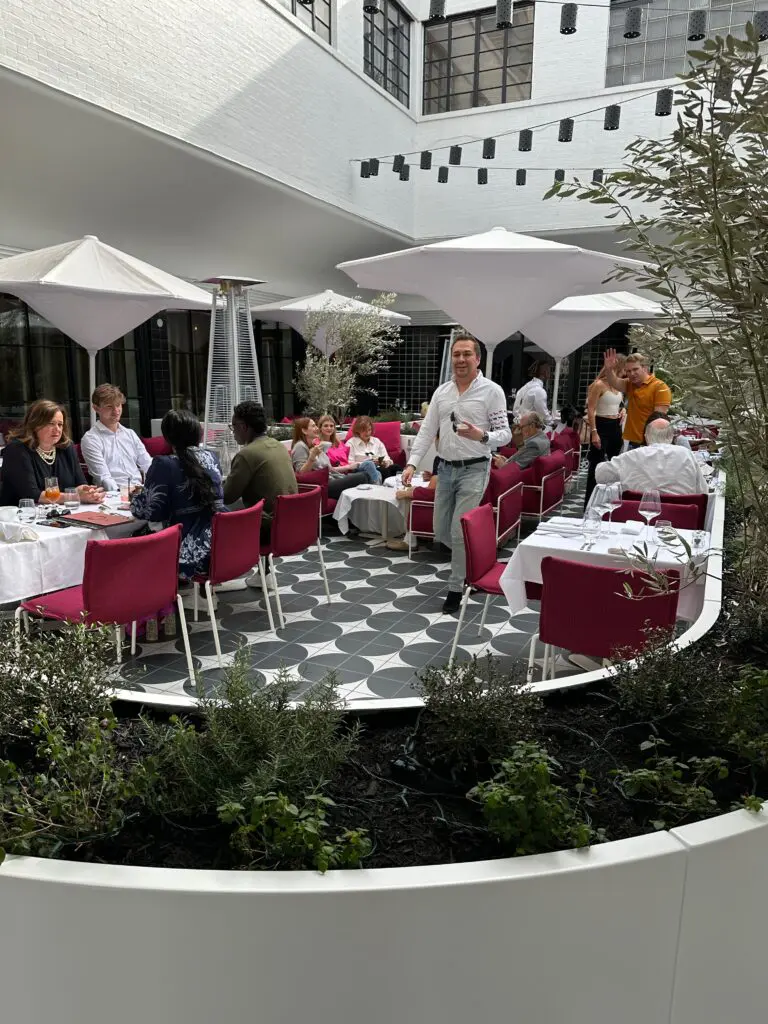 BeDesign's Adrian Dueñas strolls through the Cocody patio, the latest restaurant to join the throng in River Oaks Shopping Center. (Photo courtesy of Nina Magon Studio))