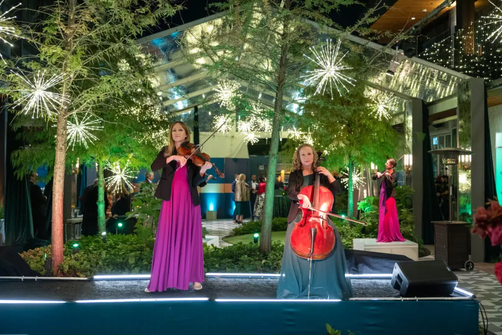 Spinphony performers entertaining at Texas Children's Hospital Ambassadors holiday party held at the Montrose Collective. (Photo by Jenny Antill/Texas Children's Hospital)