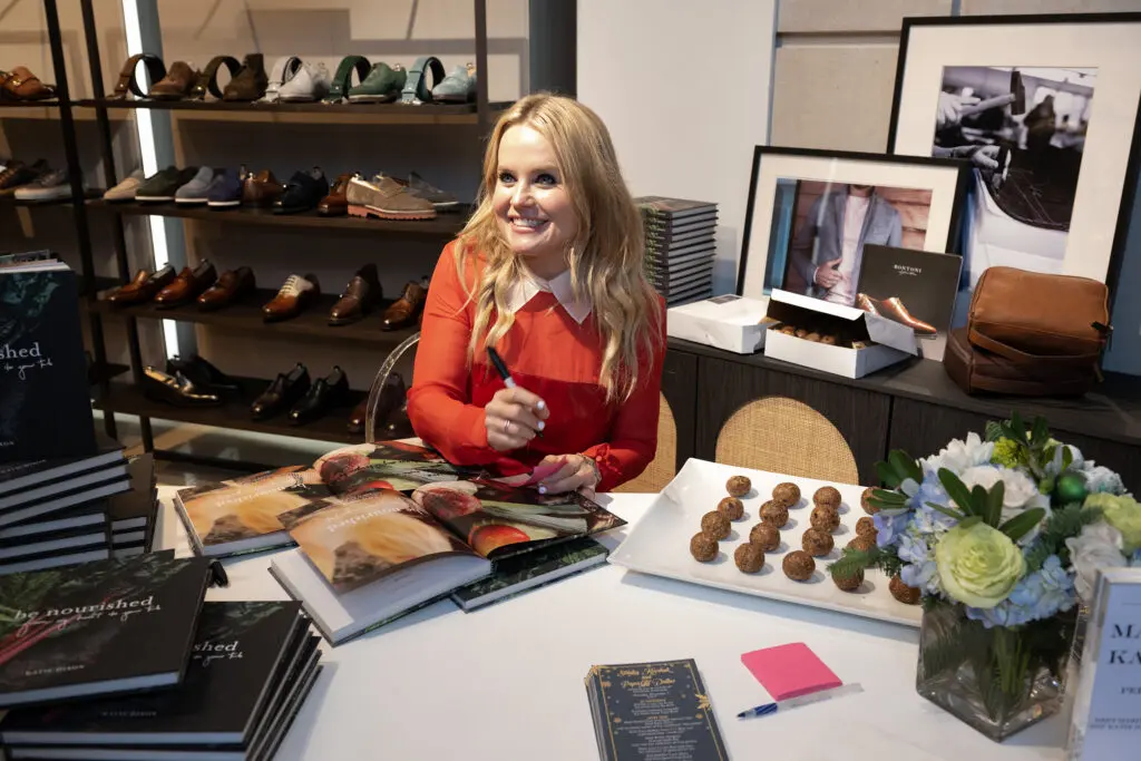 Katie Dixon signing copies of her vegan cookbook (Photo by George Fiala)