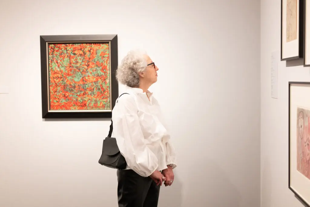 Jill Snyder viewing the Janet Sobel exhibition at The Menil Collection. (Photo by Daniel Ortiz)