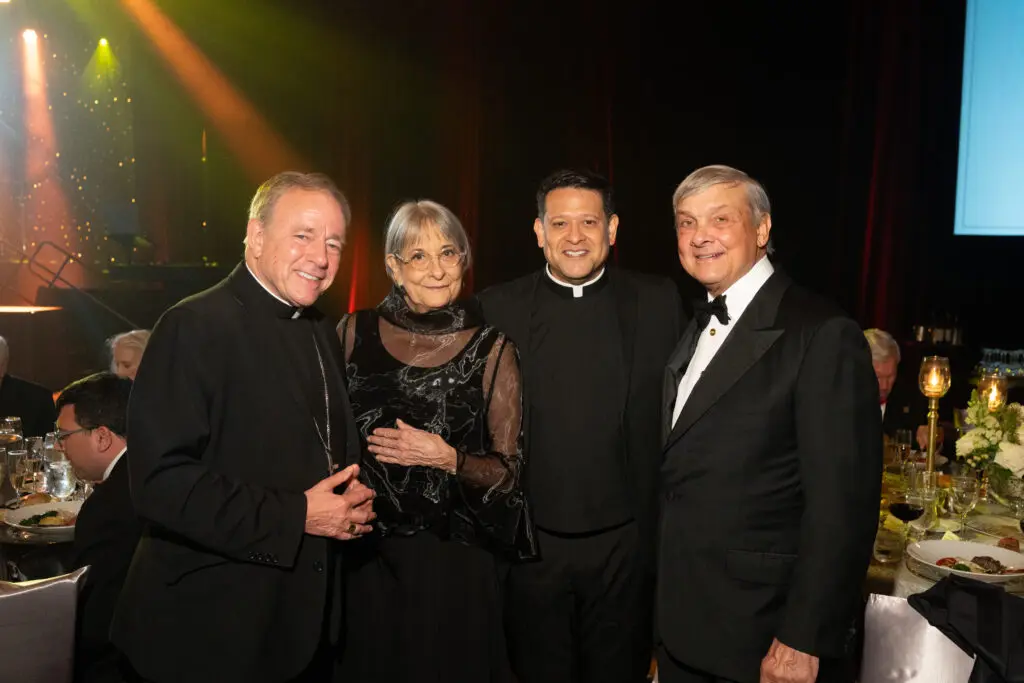 Archbishop J. Michael Miller, Annie Graham, the Rev. Dempsey Rosales-Acosta, Bob Graham at the University of St. Thomas gala (Photo by Gwen Juarez)