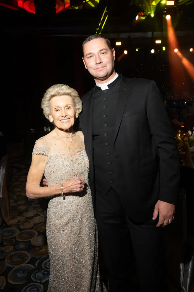 Lois Davis, Father Charles Hough at the University of St. Thomas gala (Photo by Gwen Juarez)