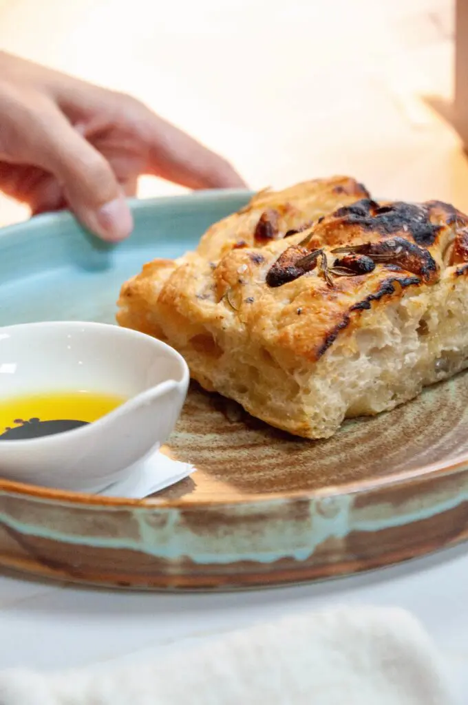 A Radici menu highlight is the rosemary and garlic confit focaccia. (Photo by Mia Valdez)