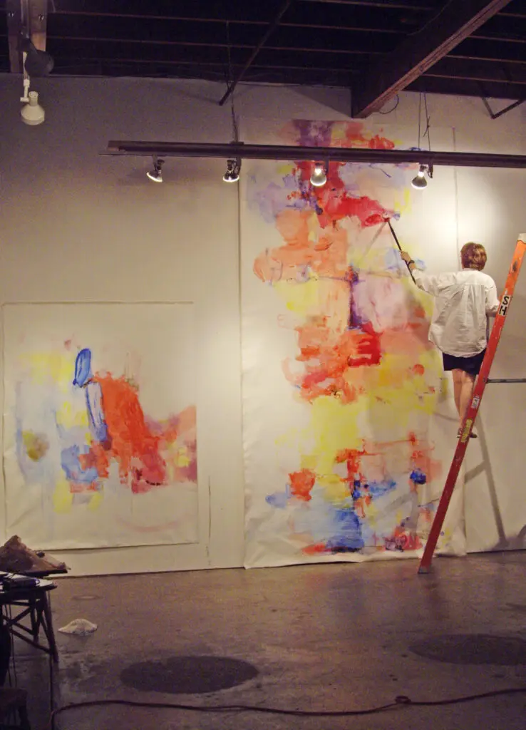 Artist Terrell James works on a painting. (Photo by Sasha Dela)