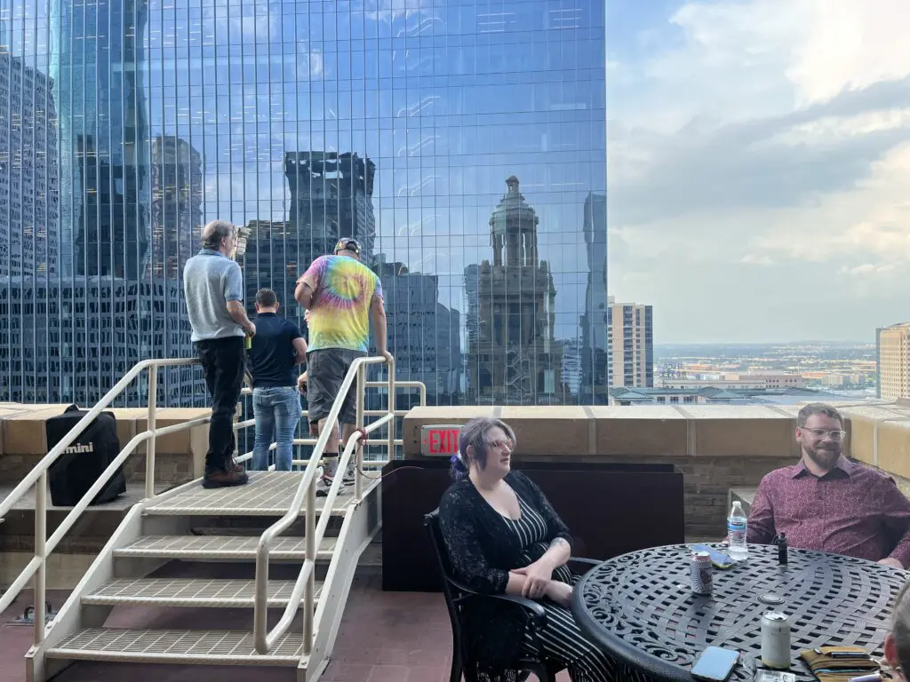Spirits remain high on the balcony at Kaze  Burning Man fundraiser at the Esperson. (Photo by Jenna Baer).