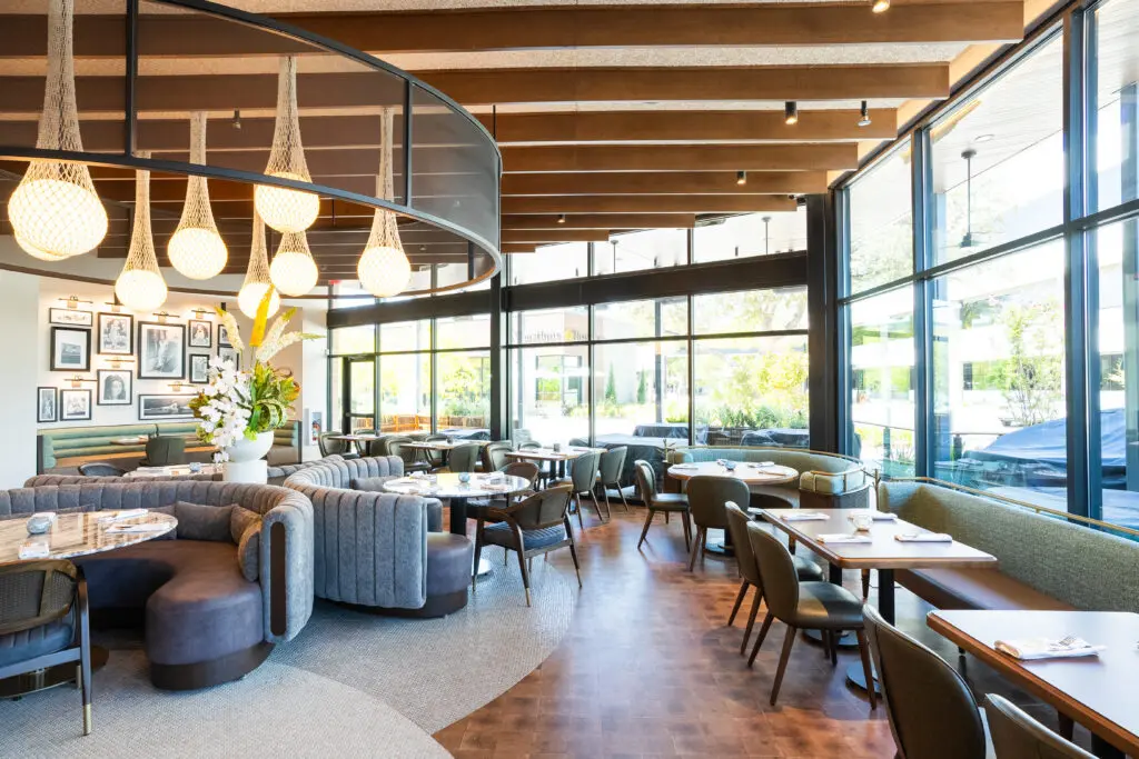 Globally-inspired, Even Coast boasts imported materials that are featured throughout and are anchored by a large feature bar. (Photo by Jasonbyg Photography)