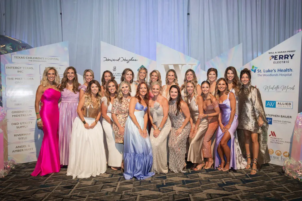 The committee for Interfaith's The Walk gala strikes a pose. The gala was chaired by Carrie Greenberg (center front left) and Kristen Byrnes (center front right). (Photo by Daniela Weaver)