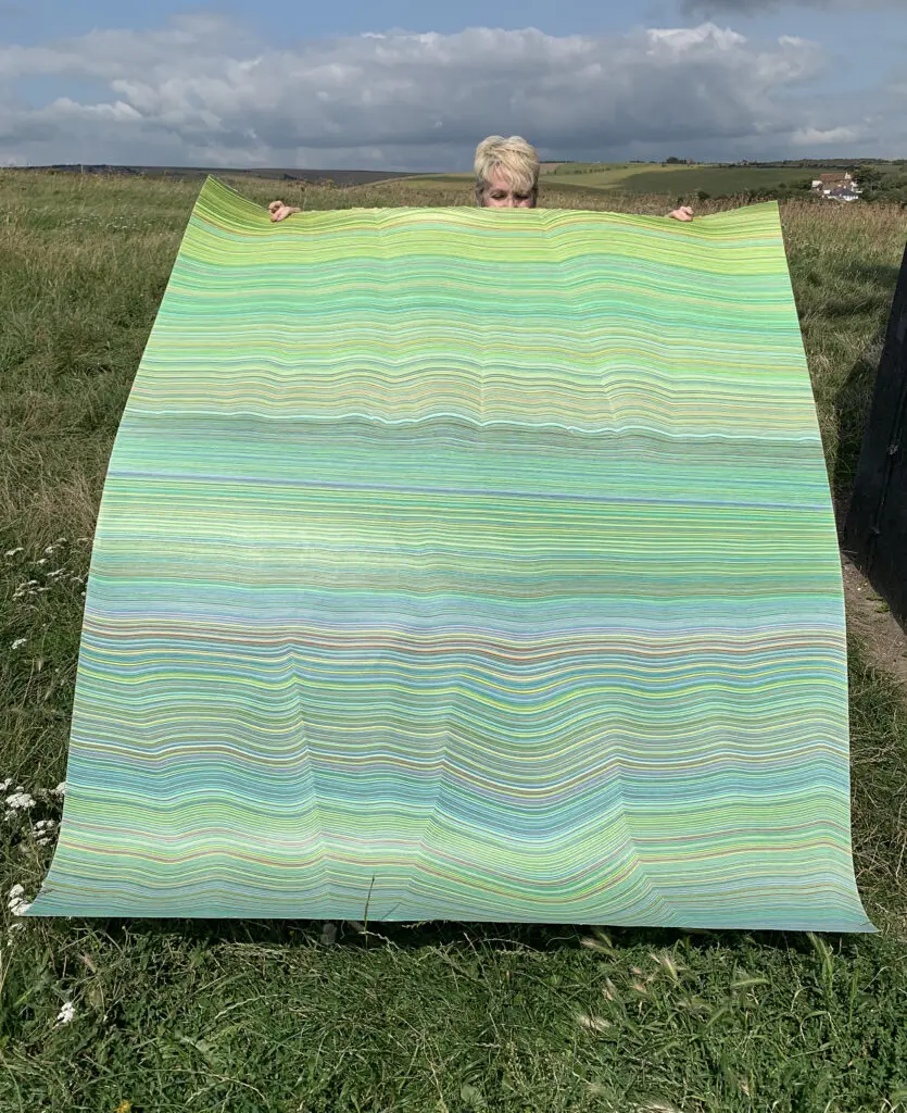 Laura Waldusky's "One Green Line," 2021, highlights the artist's unique colored pencil technique. The artist's unique paper works are showcased at Avant-Art Gallery's upcoming first anniversary exhibition.