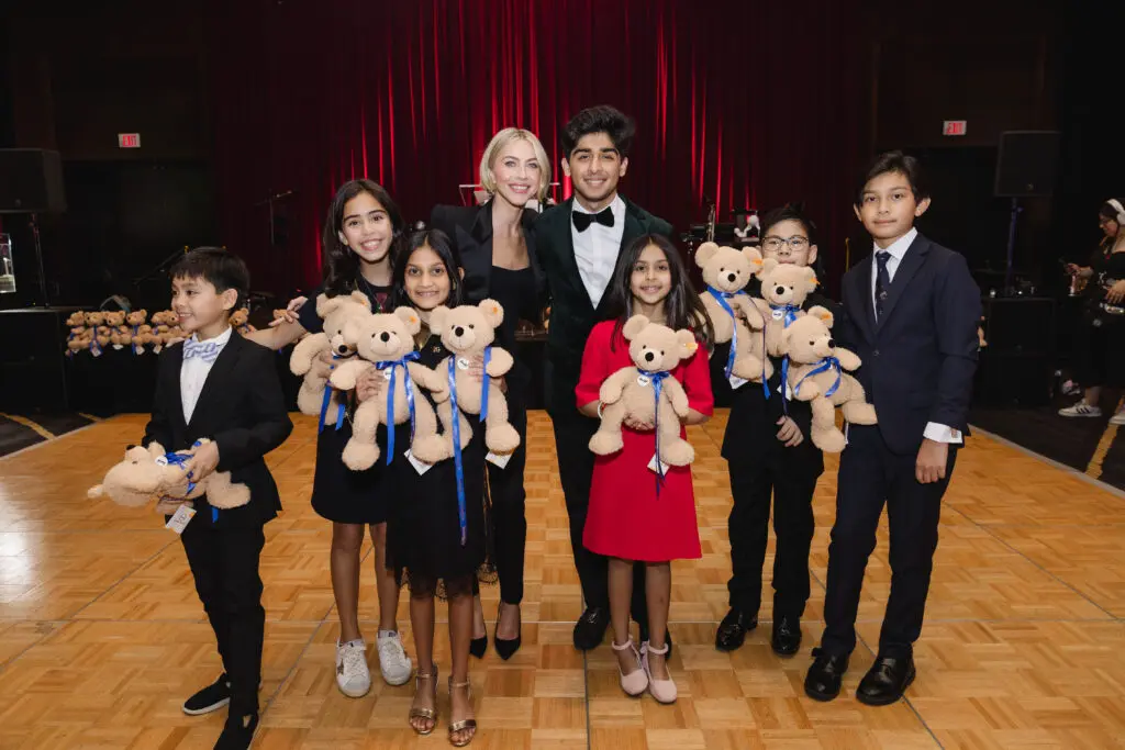 Juliane Hough with special guests at the Operation Smile Gala held at the Royal Sonesta Hotel where they handed out teddy bears to generous patrons during the paddle raise. (Photo by Johnny Than)