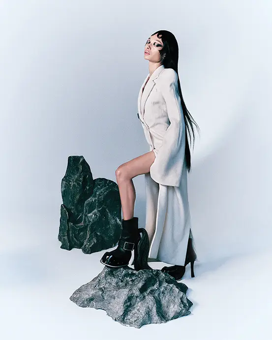 Alexander McQueen by Sean McGirr double-breasted coat $4,800, brooch $590, and hoof boot $3,390, at Alexander McQueen Highland Park Village, Neiman Marcus, Tootsies, farfetche.com, net-a-porter.com.  (Photo by Enmi Yang)
