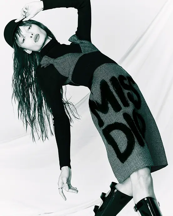 Dior bra with Miss Dior bows $2,000, Miss Dior graffiti-pattern skirt $3,000, turtleneck sweater $1,800, city cap $890, D-idole boot $2,490, and D-Pépite ring $380, at Dior Highland Park Village.  (Photo by Enmi Yang)