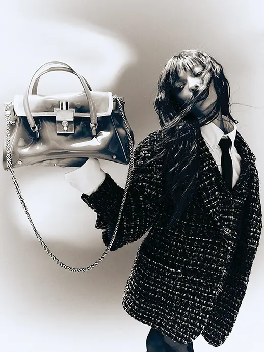 Thom Browne overcoat, patch-pocket jacket, and mini-skirt, all in black denim ribbon tweed; Oxford button-down shirt $490; twill necktie $190; and Mr. Thom luggage bags with removable rain slicker, at Forty Five Ten, Neiman Marcus, farfetch.com, modaoperandi.com, net-a-porter.com.  (Photo by Enmi Yang)