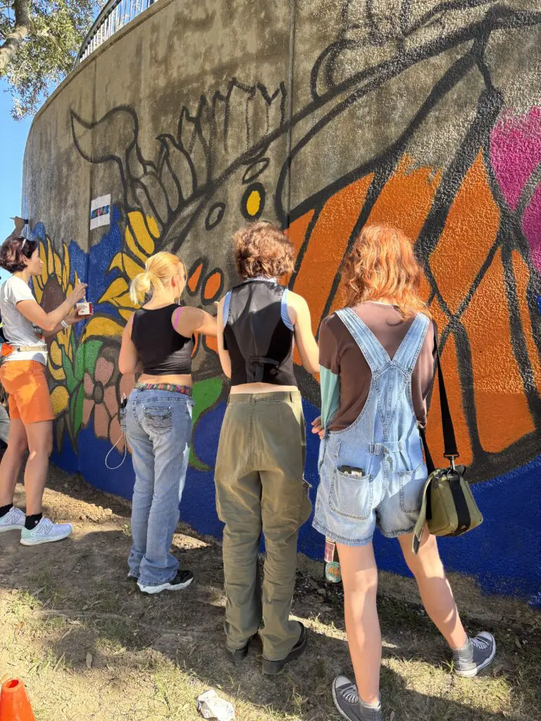 Students from neighboring Conroe ISD high schools contributed to the 50th anniversary mural near the Cynthia Woods Mitchell Pavilion. (Photo by Laura Landsbaum)