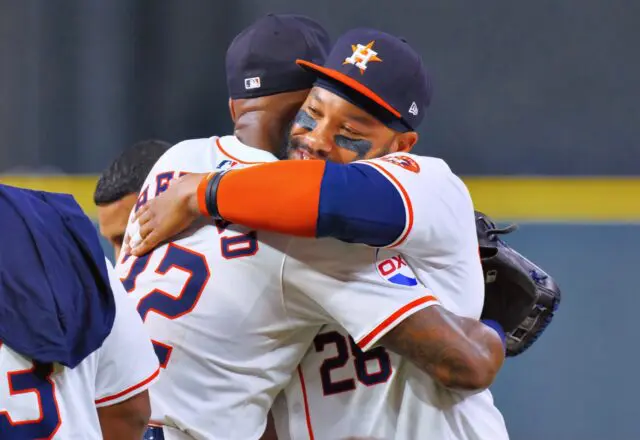 Jason Heyward and Jon Singleton hugged for another Astros championship moment. (Photo by F. Carter Smith)