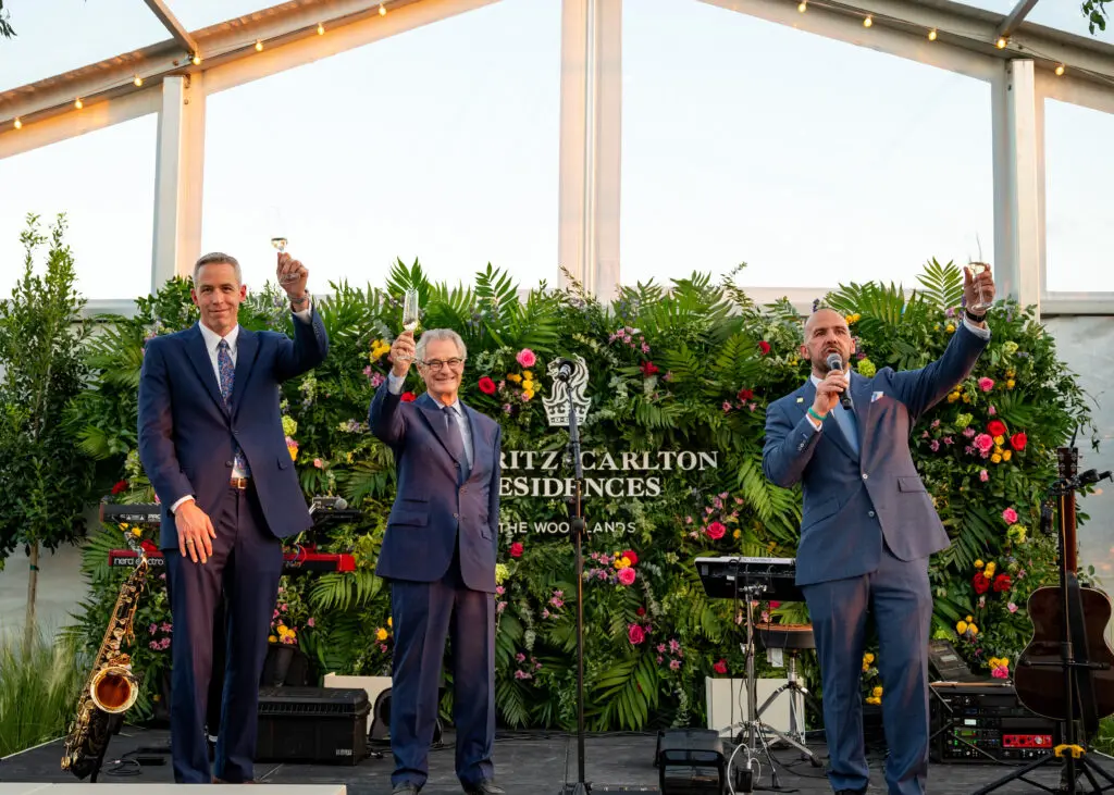 Jim Carman, Jay Cross and David Reilly of Howard Hughes toast the groundbreaking for the Ritz Carlton Residences in The Woodlands.