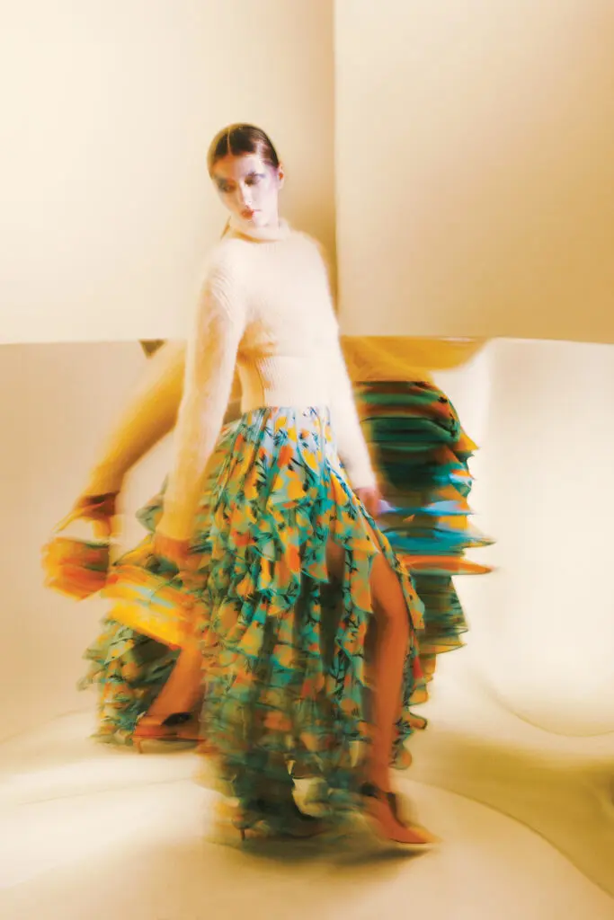 Louis Vuitton brusher mohair pullover $1,840, carnation-print skirt $7,950, petite Malle bag $8,650, and slingback pump $1,200, at select Louis Vuitton boutiques, 866.VUITTON, louisvuitton.com. (Photo by Fernando Rodriguez)