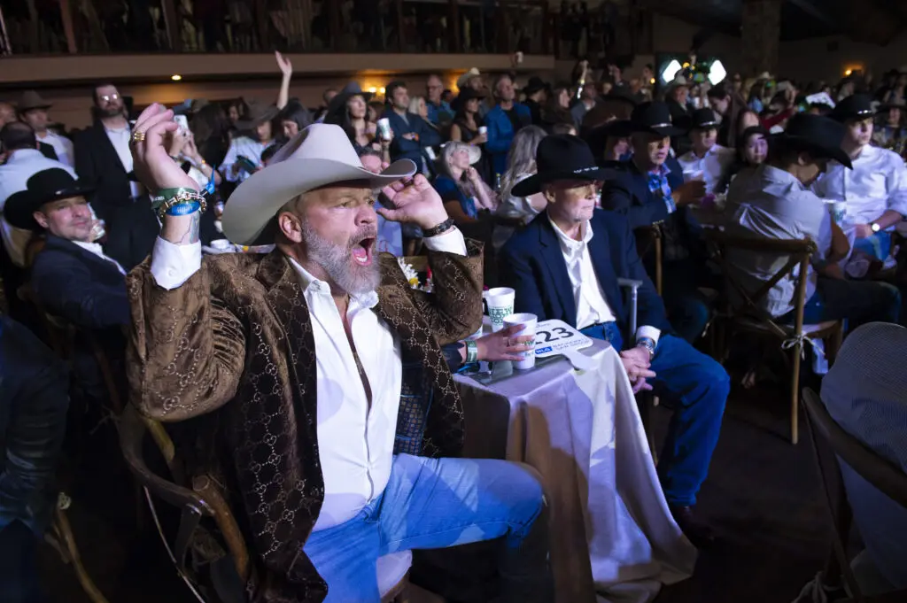 Chris Parvin lights up the live auction at the 2024 Cattle Baron's Ball. (Photo by Tamytha Cameron and Celeste Cass)