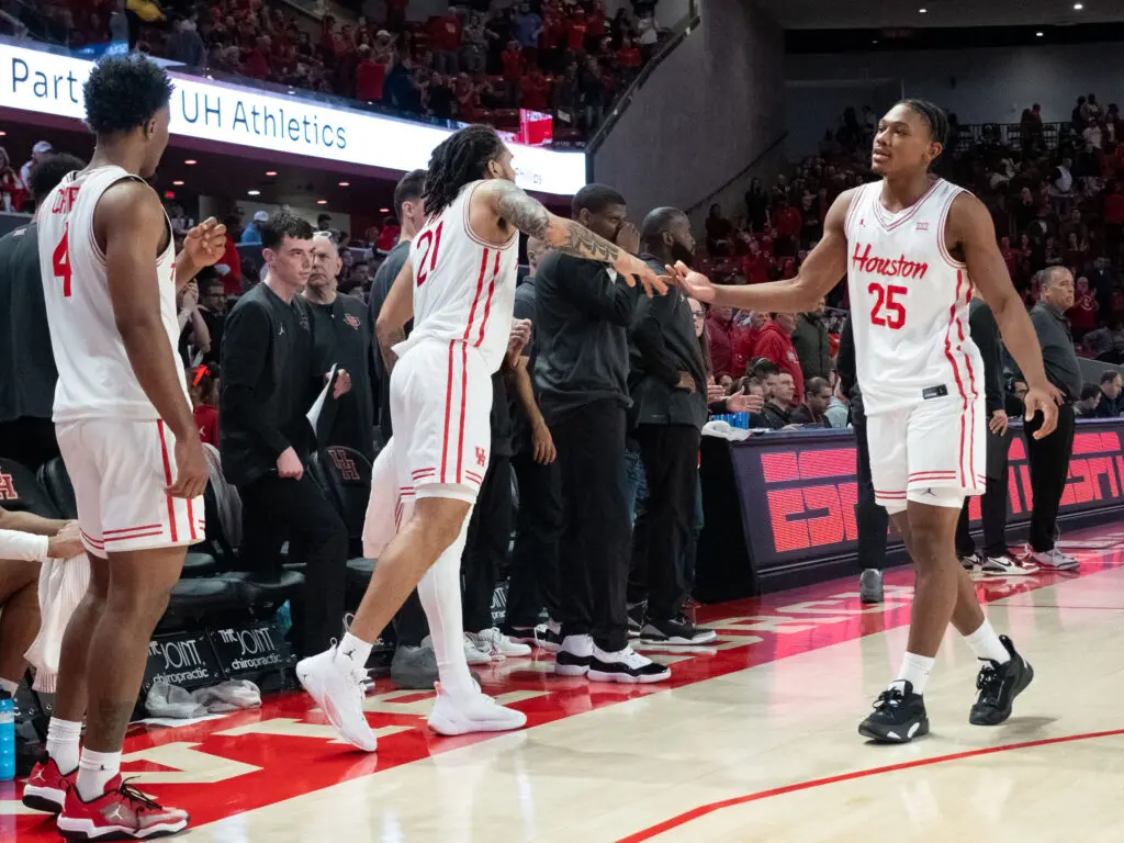 University of Houston guard Emanuel Sharp shows support for freshman Mercy Miller. (Photo by F. Carter Smith)