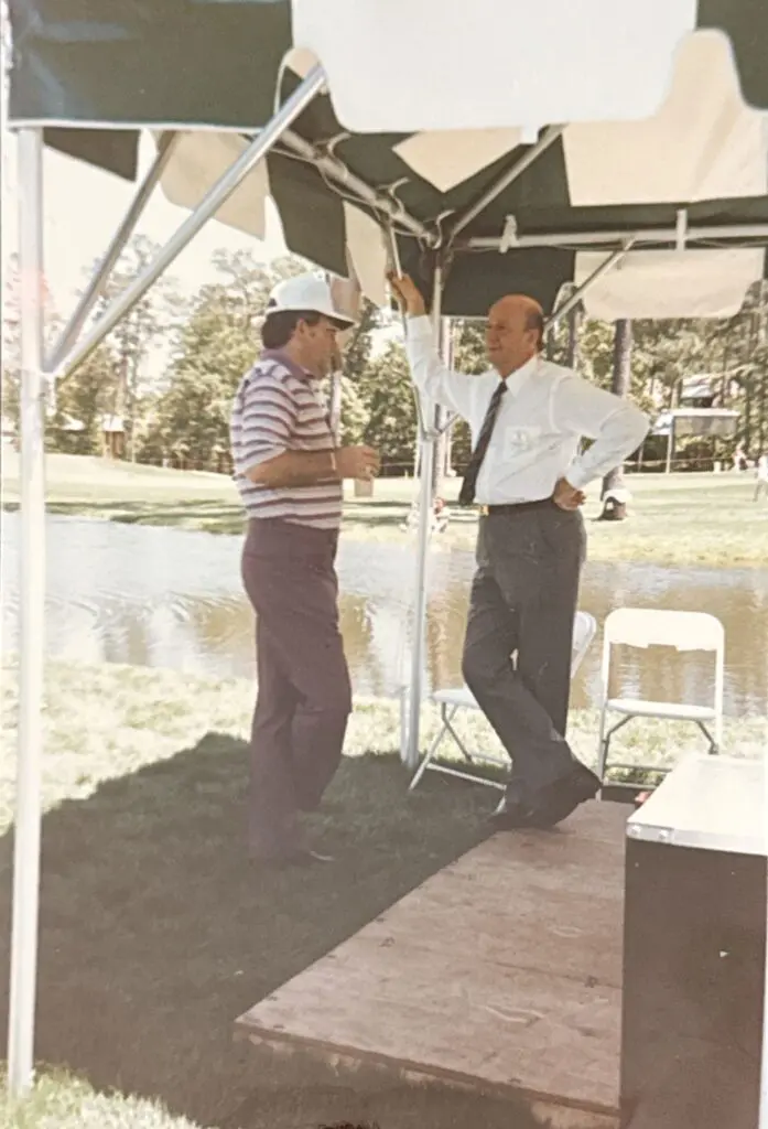 Earl Higginsl talks with George Mitchell, the visionary founder of The Woodlands. Mitchell wasn’t a golfer, but he recognized what world-class golf could do for The Woodlands. (Courtesy Earl Higgins)