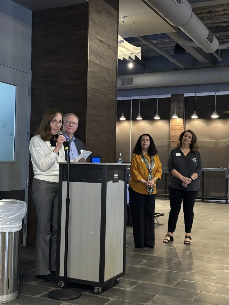 Cindy and Rob Hardin spoke about the reasons for underwriting the "Windswept Oak" bench at the Woodforest Bank Club at the Cynthia Woods Mitchell Pavilion on December 2.