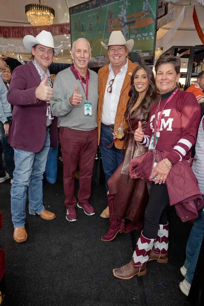 Russell White, famed former A&M coach R.C. Slocum, Pete Bell, Zinat Ahmed, Nel Slocum at Cotton Holdings' tailgate party at the Lone Star Showdown. (Photo courtesy of Cotton Holdings) 