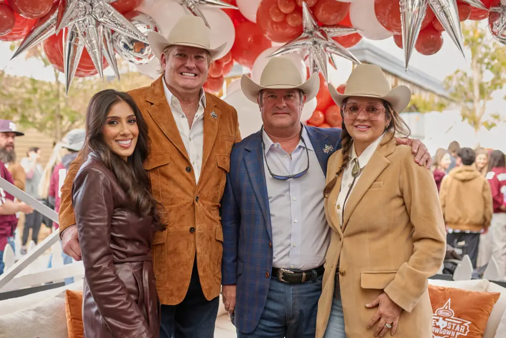 Zinat Ahmed, Pete Bell, Johnny & Debra Slaughter at Cotton Holdings' tailgate party at the Lone Star Showdown. (Photo courtesy of Cotton Holdings) 