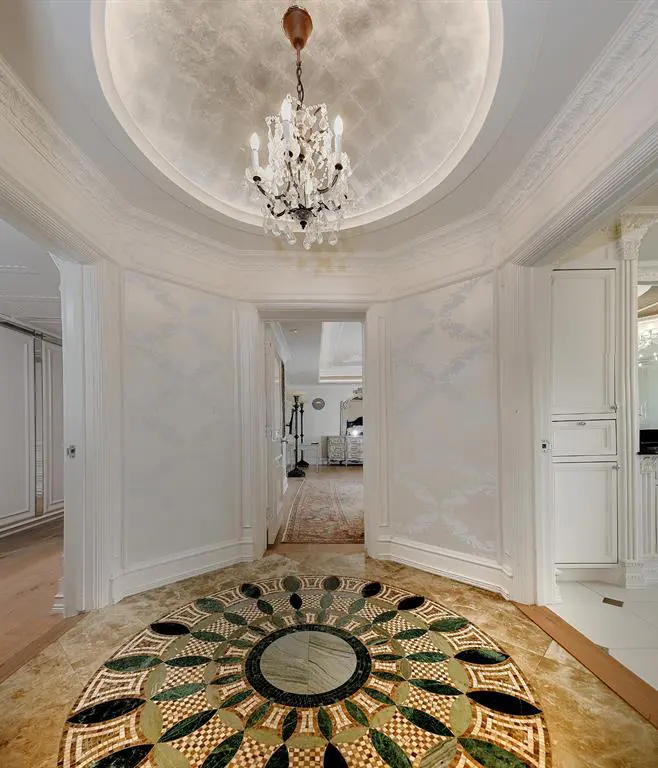 A lavish foyer leading to one of the two third floor bedrooms