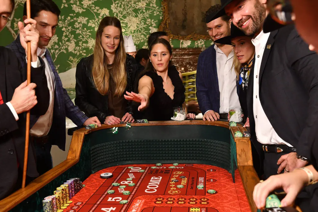 Bridget Stephens throws the dice at The Bryan Museum's 'Come and Take It' poker tournament (Photo by Dave Rossman)