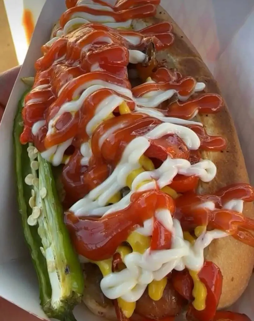 EL Salchichón FW's decadent bacon-wrapped hotdog, loaded with chorizo and melted white cheese, is a smoky, spicy indulgence.  (Courtesy)