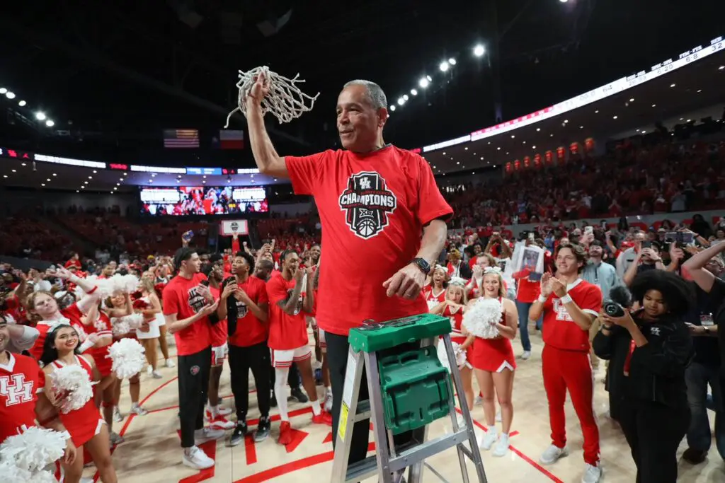University of Houston coach Kelvin Sampson cuts down nets. It's what his championship programs do. (@UHCougarMBK)