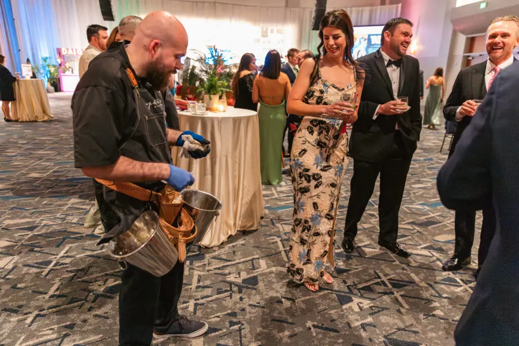 A live oyster shucker kept cocktail hour lively. (Photo courtesy of TWCA)