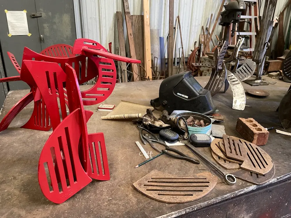 A work table situated within artist Mac Whitney's  sculpture studio. (Photo by Susan Chadwick. Courtesy Andrew Durham Gallery, Houston)