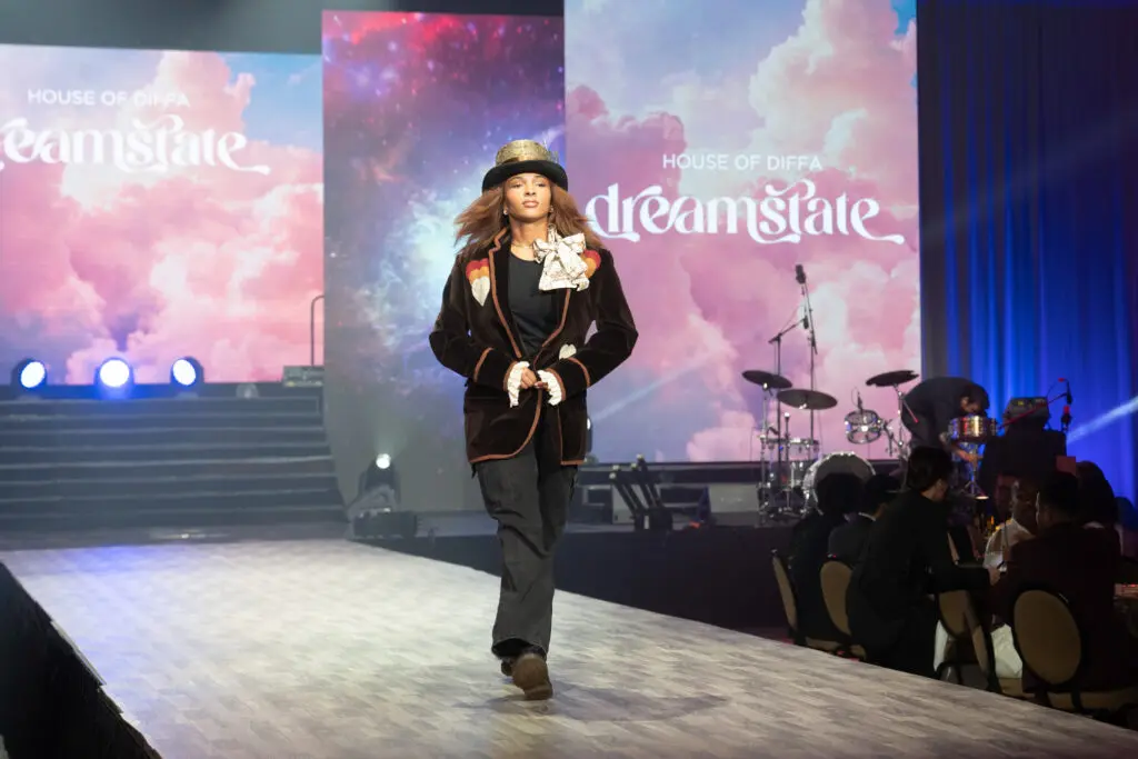 A Booker T. Washington senior modeling Luxury Jacket (Photo by Danny Campbell)