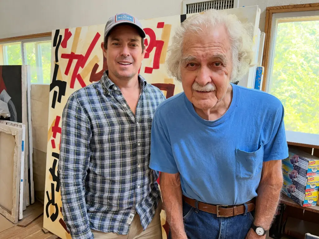 Gallerist Andrew Durham and artist Mac Whitney during Durham's visit to Whitney's studio and property in Ovilla, Texas. Durham hosted a solo exhibition for the late artist through January 2025 at the Andrew Durham Gallery in Houston. (Courtesy Andrew Durham Gallery, Houston)