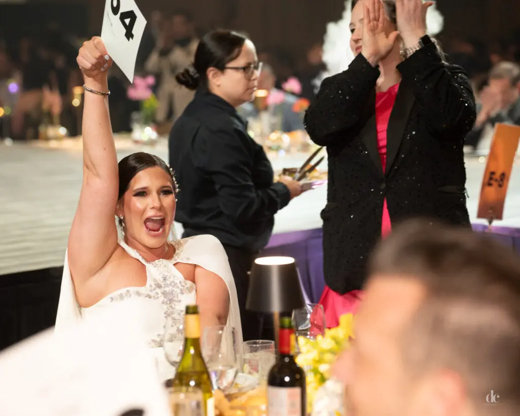 Tori Kunz bidding the the live auction (Photo by Danny Campbell)