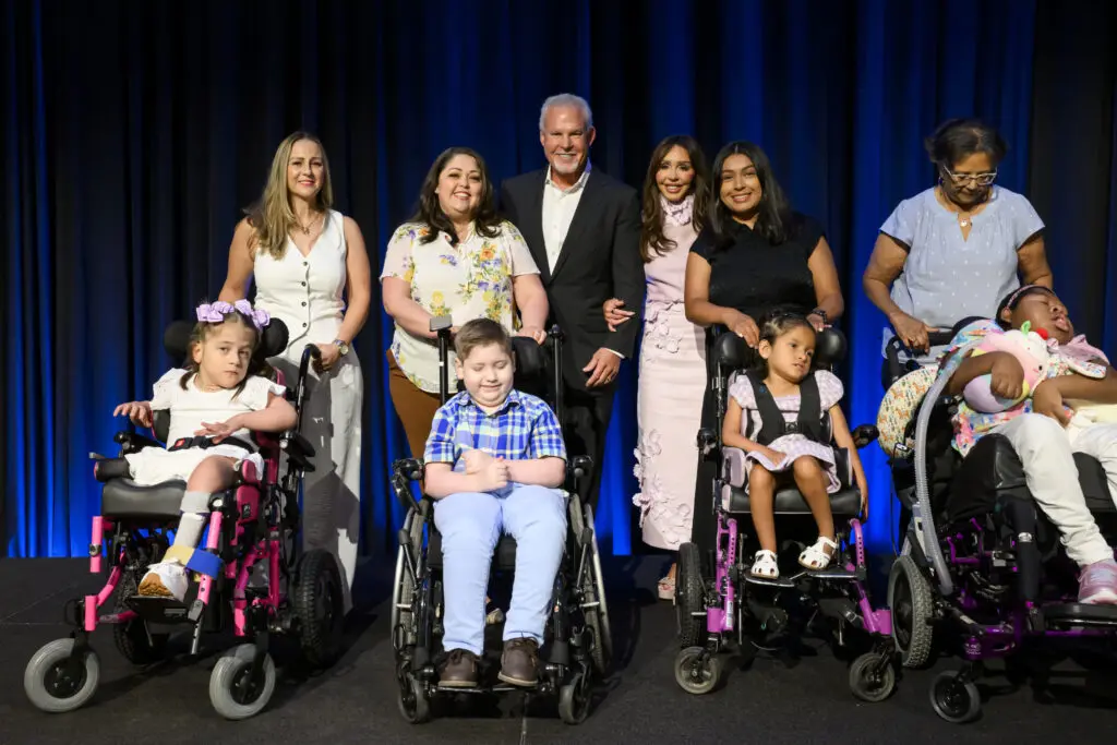 Houston Children's Charity patrons Richard and Jana Fant with recipients of the Chariots for Children program.