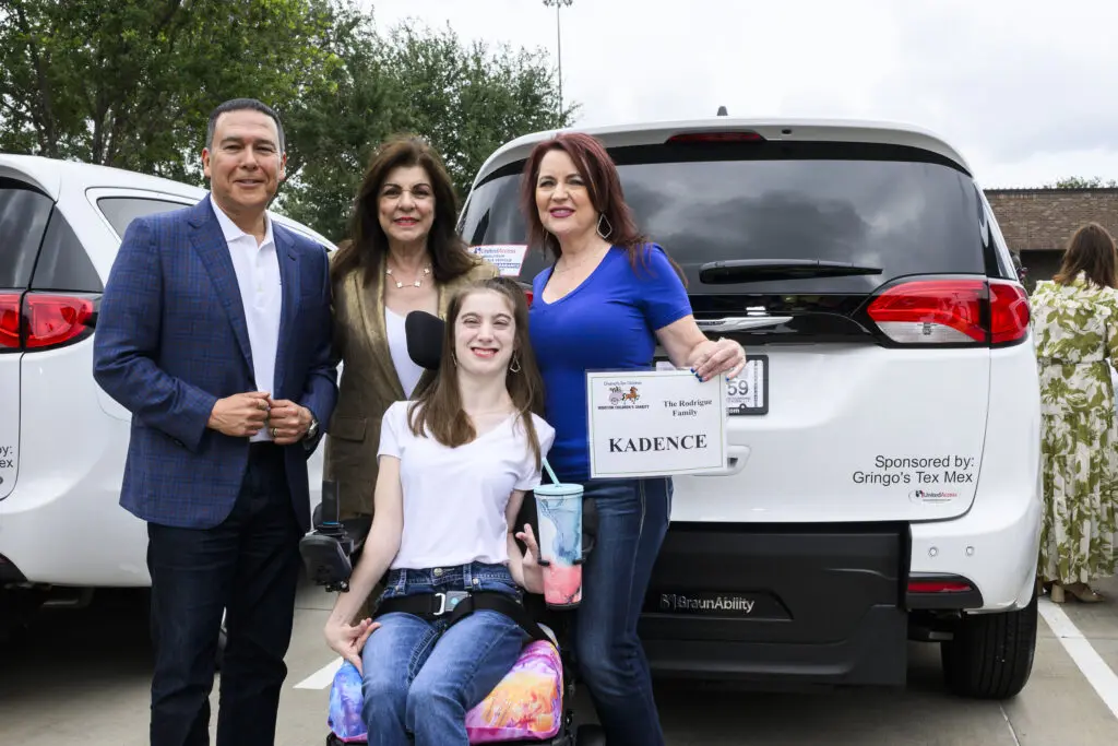 Gringo's CEO Russell Ybarra, Laura Ward and recipients of the Chariots for Children van.