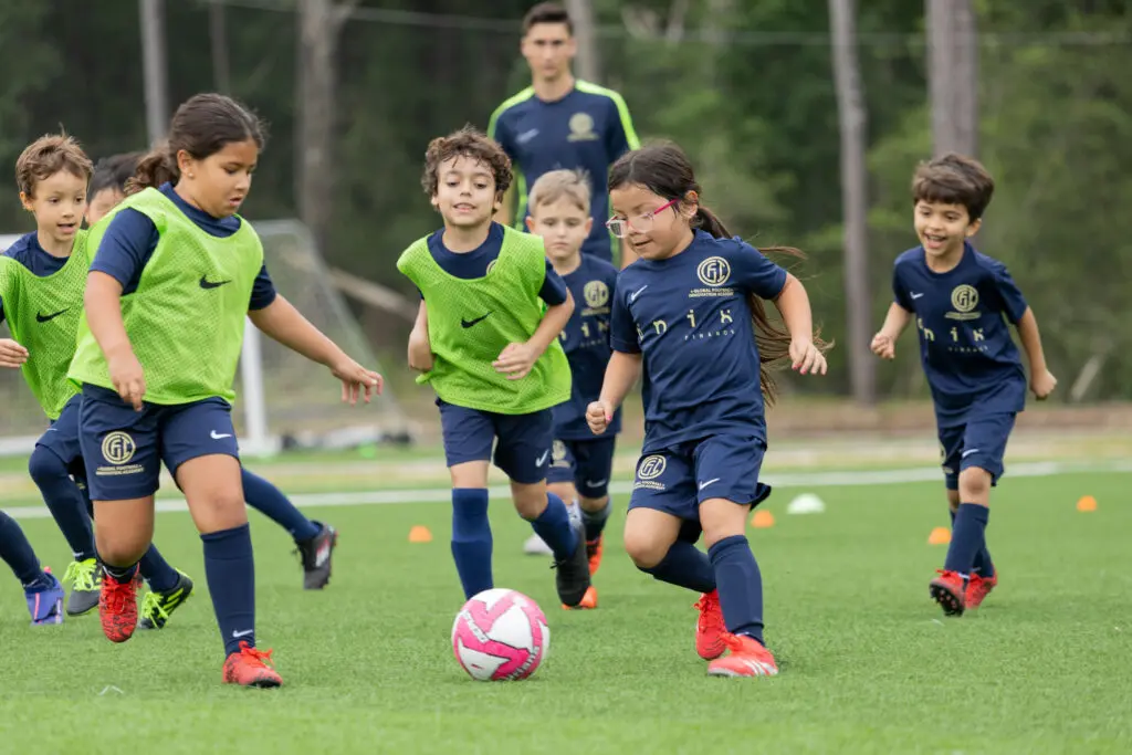 Boys and girls learn soccer skills in Houston’s Global Football Innovation programs. (Photo by Juanita Moreno)