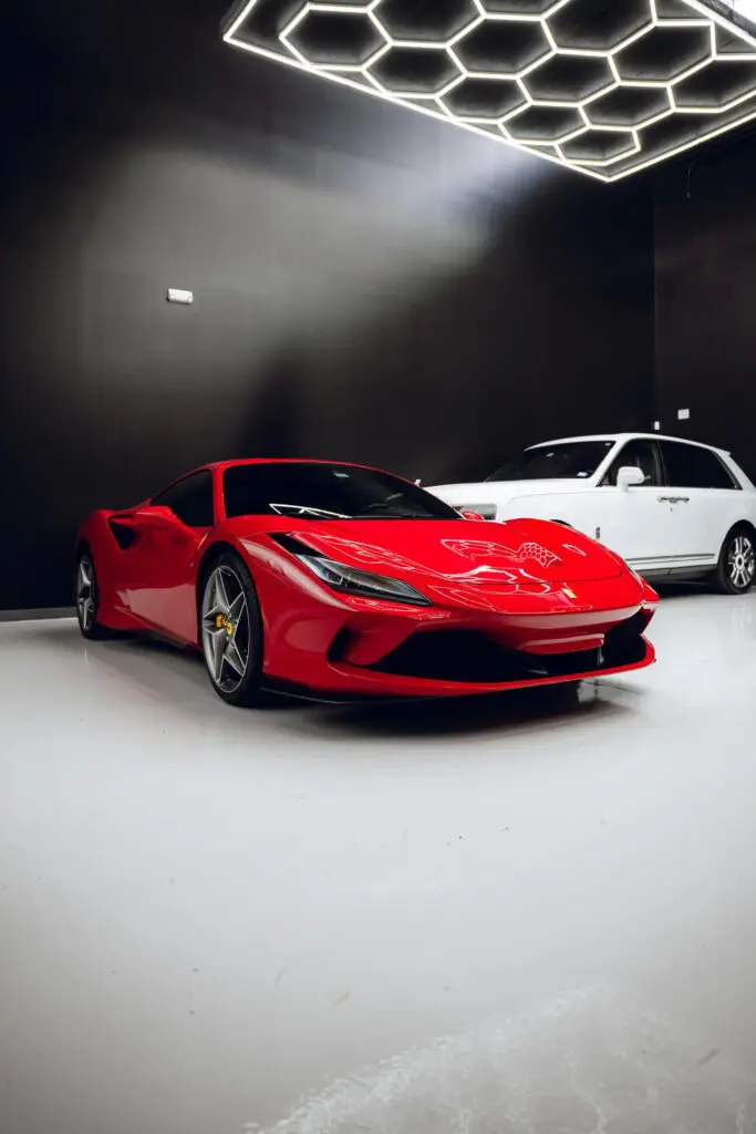 One of Luxe AF Motors’ striking red exotics is parked and ready for its next outing. (Photo courtesy Luxe AF Motors)
