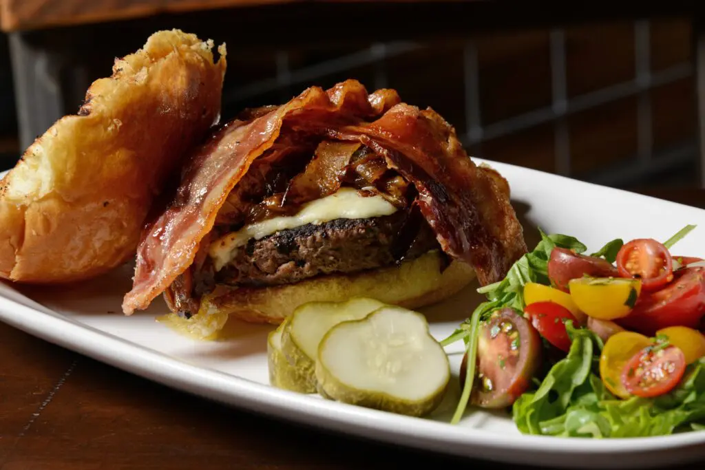 We loved Henry's Majestic for its spacious outdoor patio, live music stage, and bone marrow burger. (Courtesy)