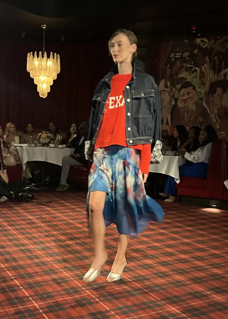 The model wears the 'Texans' cashmere sweater, denim jacket and skirt all from the Christy Lynn capsule collection for the Houston Texans.