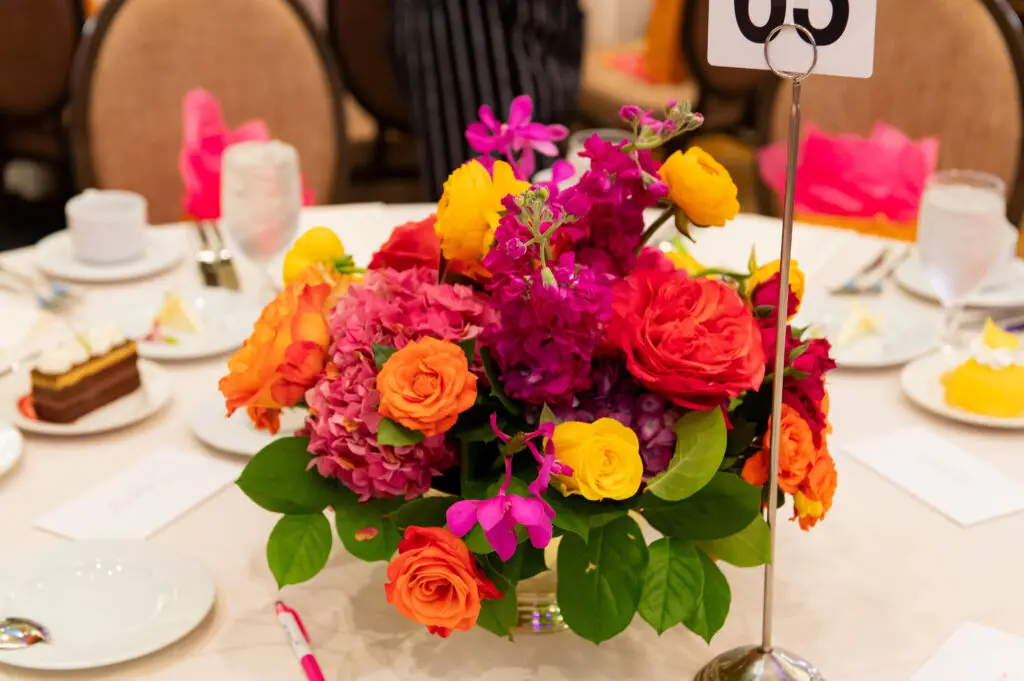 Vibrant floral centerpieces at Stand For Her (Photo by Tamytha Cameron and Celeste Cass)