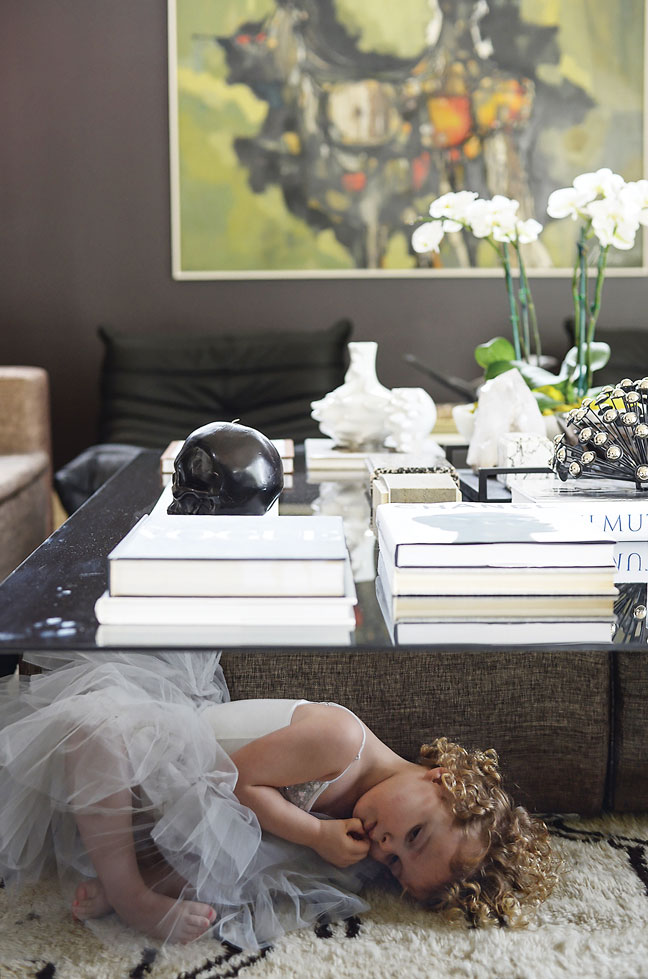 Clair’s daughter Slayton channels a ballerina on a Moroccan rug by Beni Ouarain — curls courtesy of outstanding DNA.