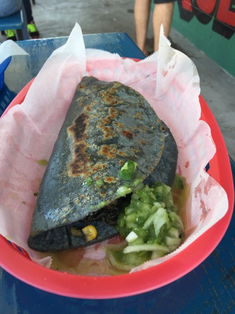 A family makes this: blue corn tortilla with huitlacoche and cheese.