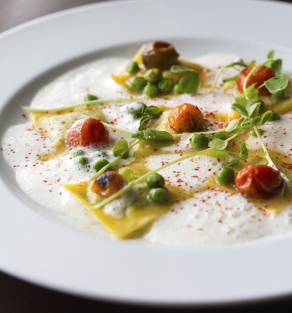 TABLE’s Spring Pea Ravioli, available on the HRW dinner menu.
The dish includes cherry tomatoes, pea shoots, fresh mint, and parmesan broth.