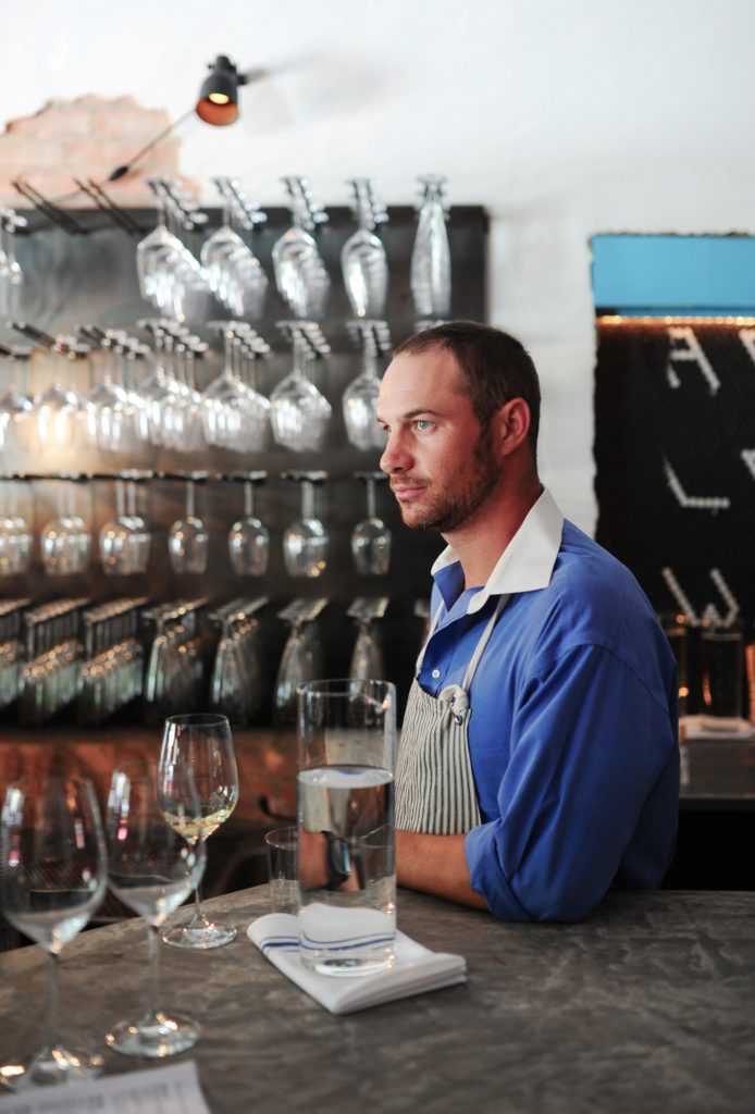 Ryan Cooper tends the bar at Camerata. (Photo by Debora Smail)